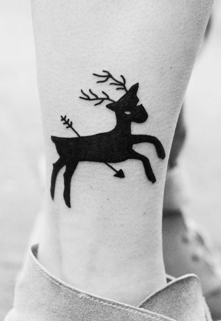 Shot deer tattoo