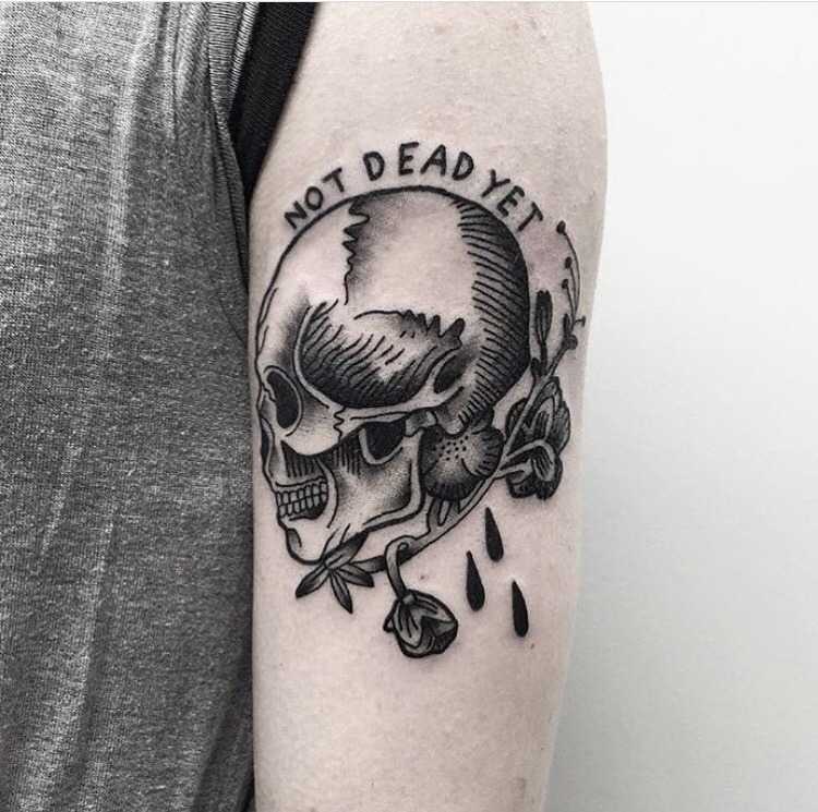 Skull tattoo by Kev Richardson