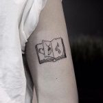Small open book tattoo
