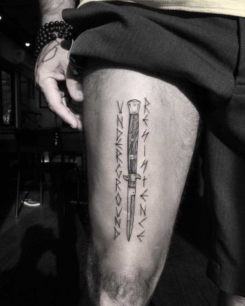 Stiletto and runes tattoo