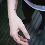 Tiny star tattoos on the arm