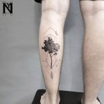 Tree tattoo on the left calf