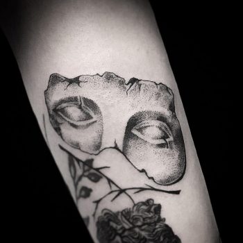 Antique sculpture's part tattoo