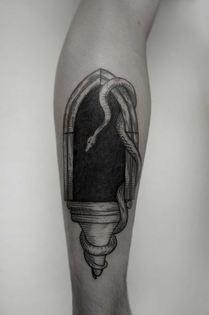 Architectural element and snake tattoo by SVA