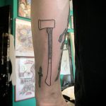 Big ax tattoo by Kirk Budden