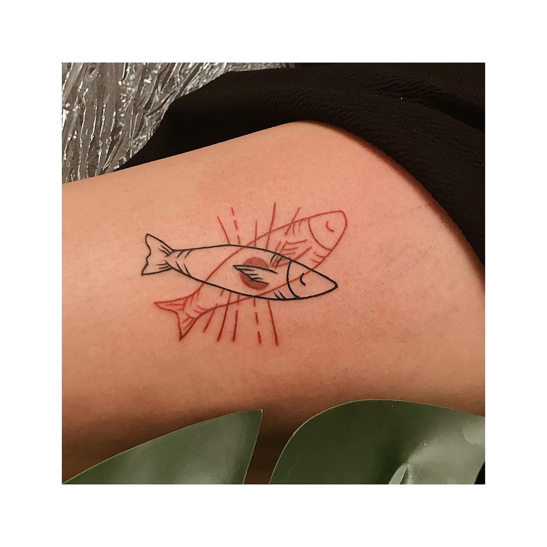 Black and red fish tattoo