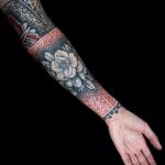 Black and red half-sleeve tattoo