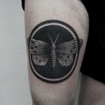 Black circle moth tattoo by SVA