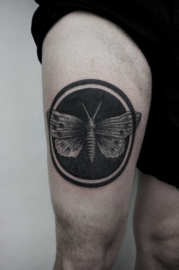 Black circle moth tattoo by SVA