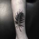 Black feather tattoo by Johnny Gloom