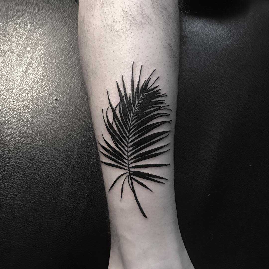 Black feather tattoo by Johnny Gloom