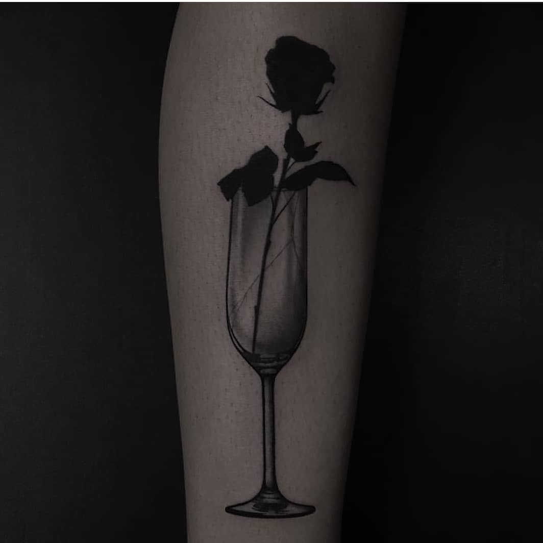 Black rose in a glass