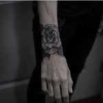 Black rose tattoo by Silveira Tattooer