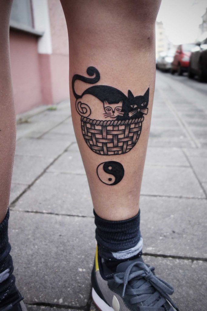 Cats in a basket tattoo