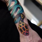 Colorful snake tattoo by Aleksy Marcinów