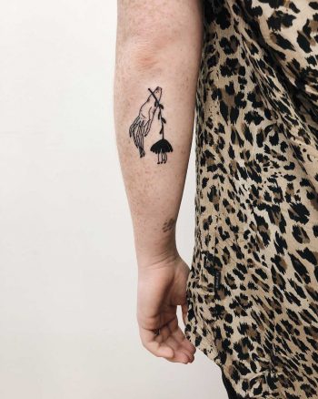 Creepy hand and flower tattoo