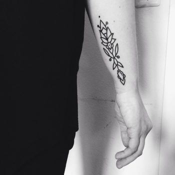 Custom black ornament on the right forearm