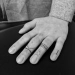 Delicate finger tattoos by Oliver Whiting