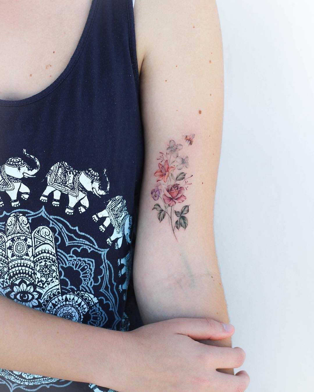 Delicate flower bouquet tattoo