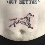 Dog tattoo on a belly by Deborah Pow