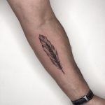Feather tattoo by Conz Thomas
