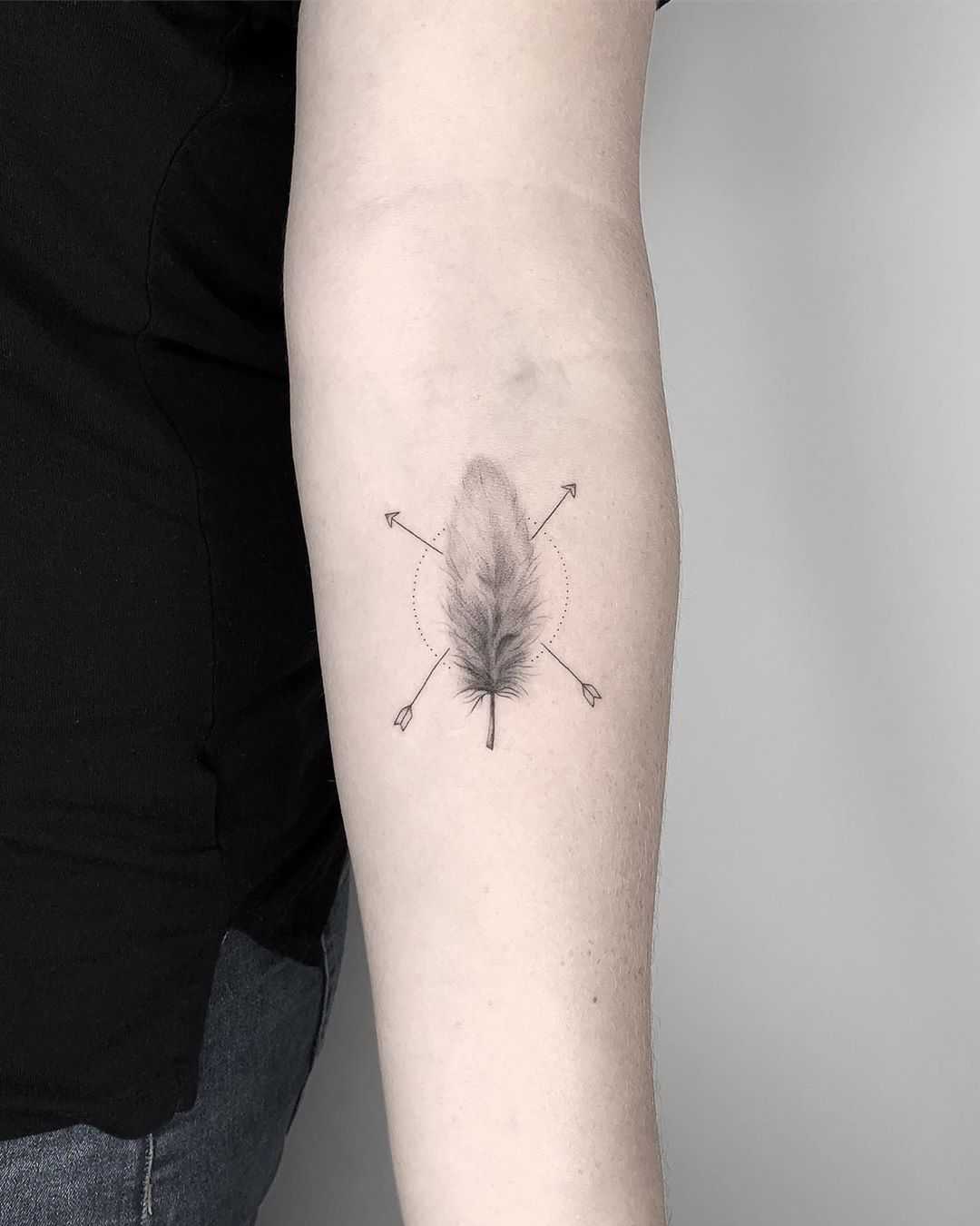 Fineline feather tattoo by Conz Thomas