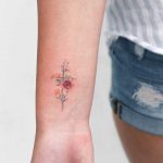 Floral cross tattoo by Iris Art