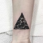 Floral triangle tattoo by Deborah Pow
