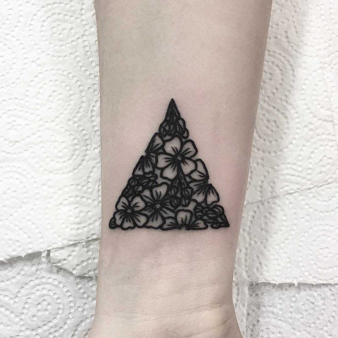 Floral triangle tattoo by Deborah Pow