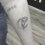 Flower and dot-work moon tattoo