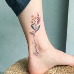 Flower and name ankle tattoo