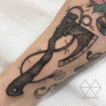 Free-handed axe tattoo
