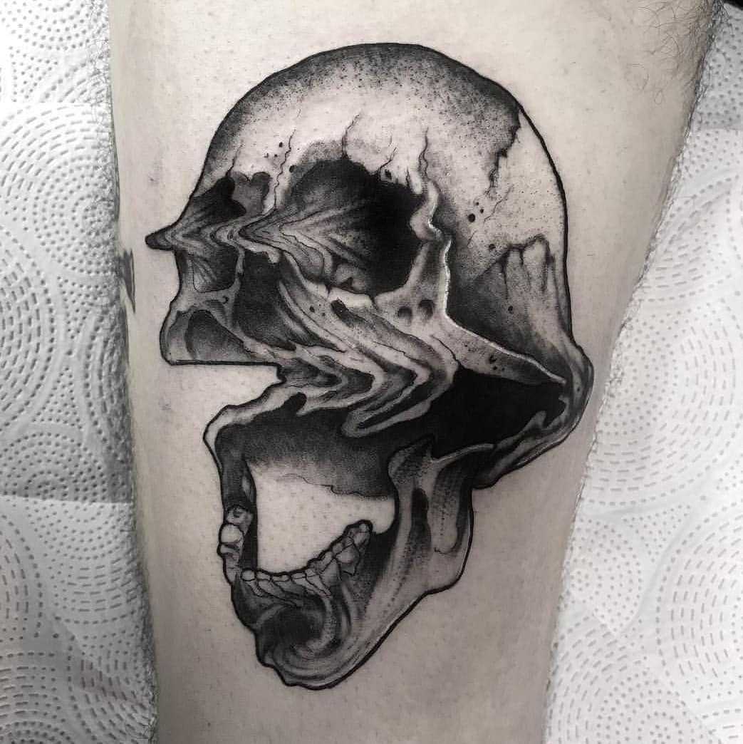 Glitched skull tattoo