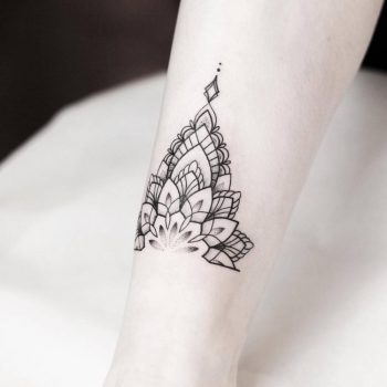 Half mandala ankle tattoo