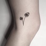 Hand-poked small mushrooms tattoo