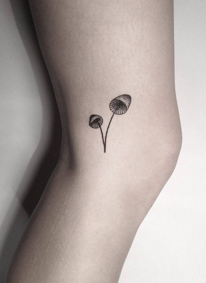Hand-poked small mushrooms tattoo 