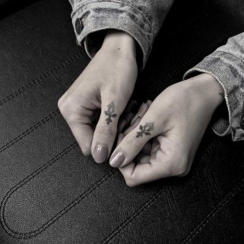 Hand-poked thumb tattoos by Oliver Whiting
