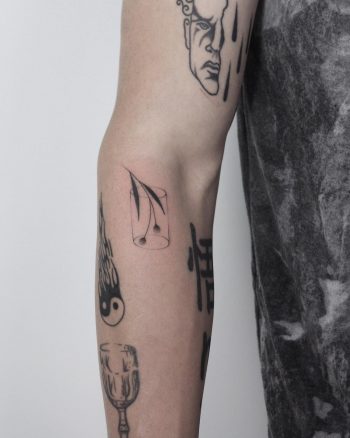 Hand-poked vase tattoo by Lara Maju