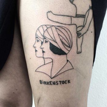 Heads with bandages tattoo