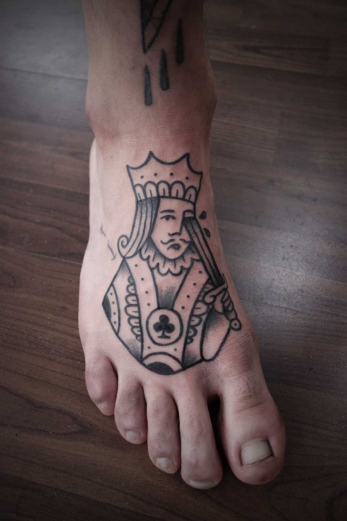 King tattoo on the foot