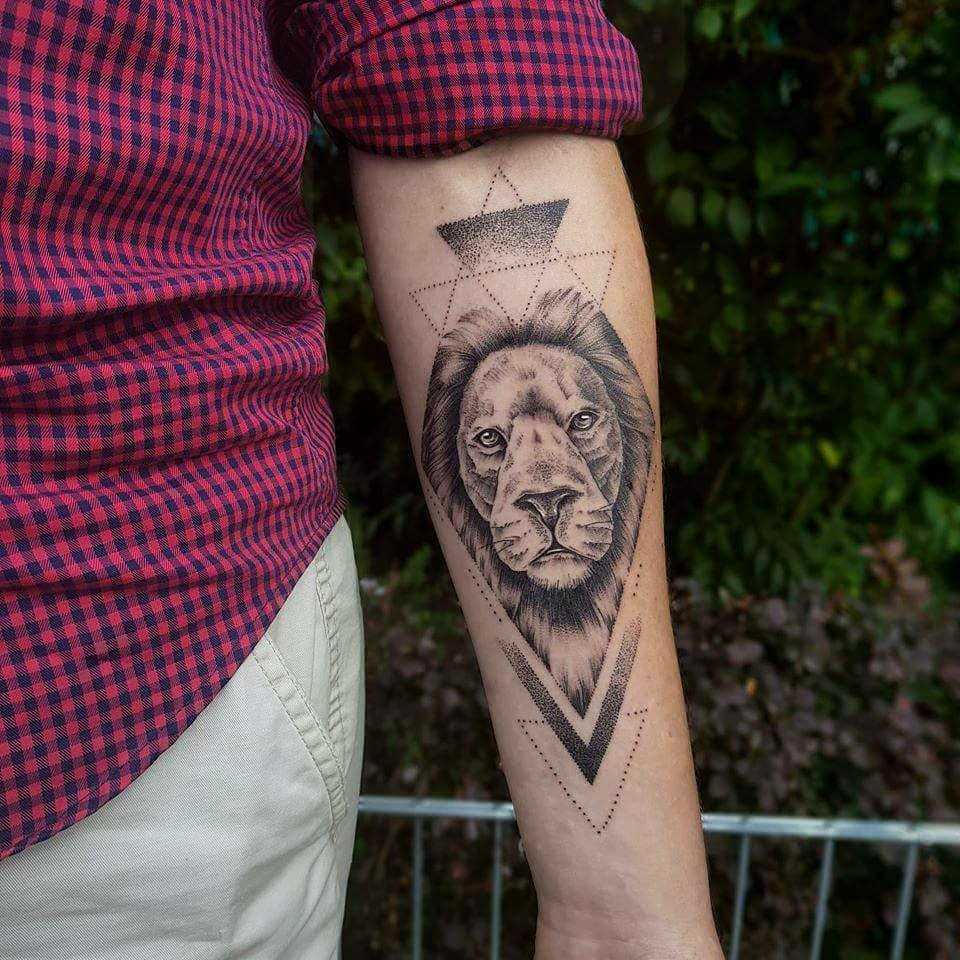 Lion and geometry tattoo