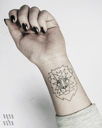 Lion tattoo on the wrist by Warda