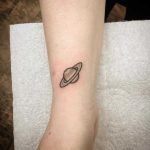 Little Saturn tattoo by Kirk Budden