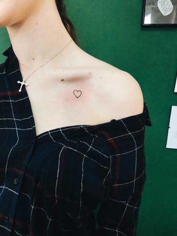 Little heart tattoo on the clavicle