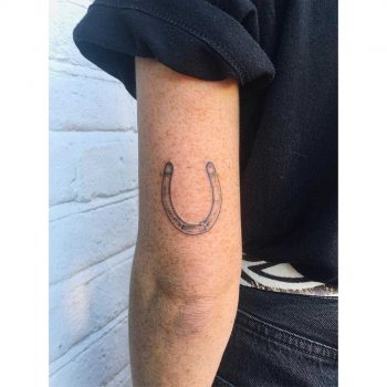 Little horseshoe by tattooist Zaya