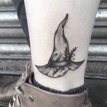Little witch hat tattoo by Lozzy Bones