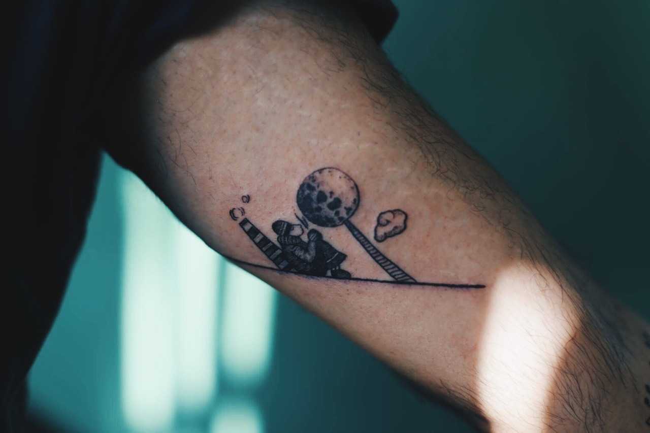 Man and the moon tattoo
