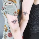 Matching bee tattoos by Jay Rose