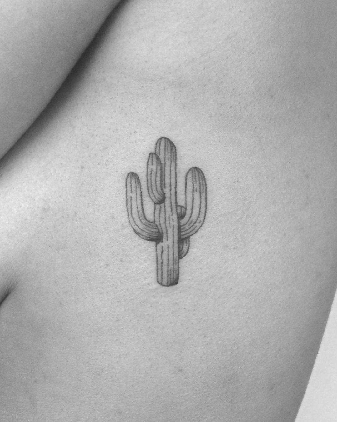 Minimalist cactus tattoo on the rib cage