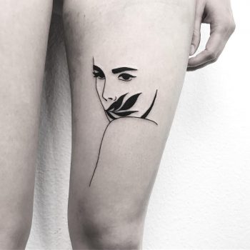 Minimalist girl's face tattoo